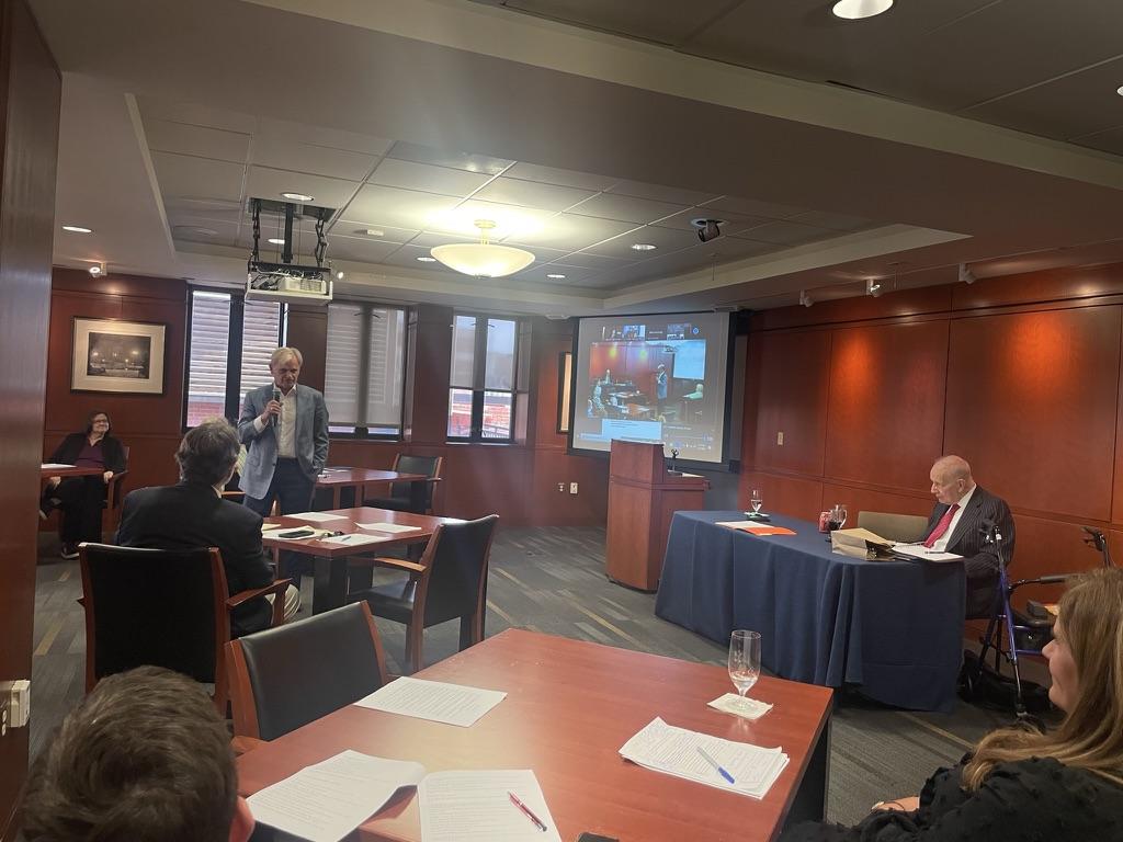 A group of people attending an event in the Faculty Conference Center in the law school